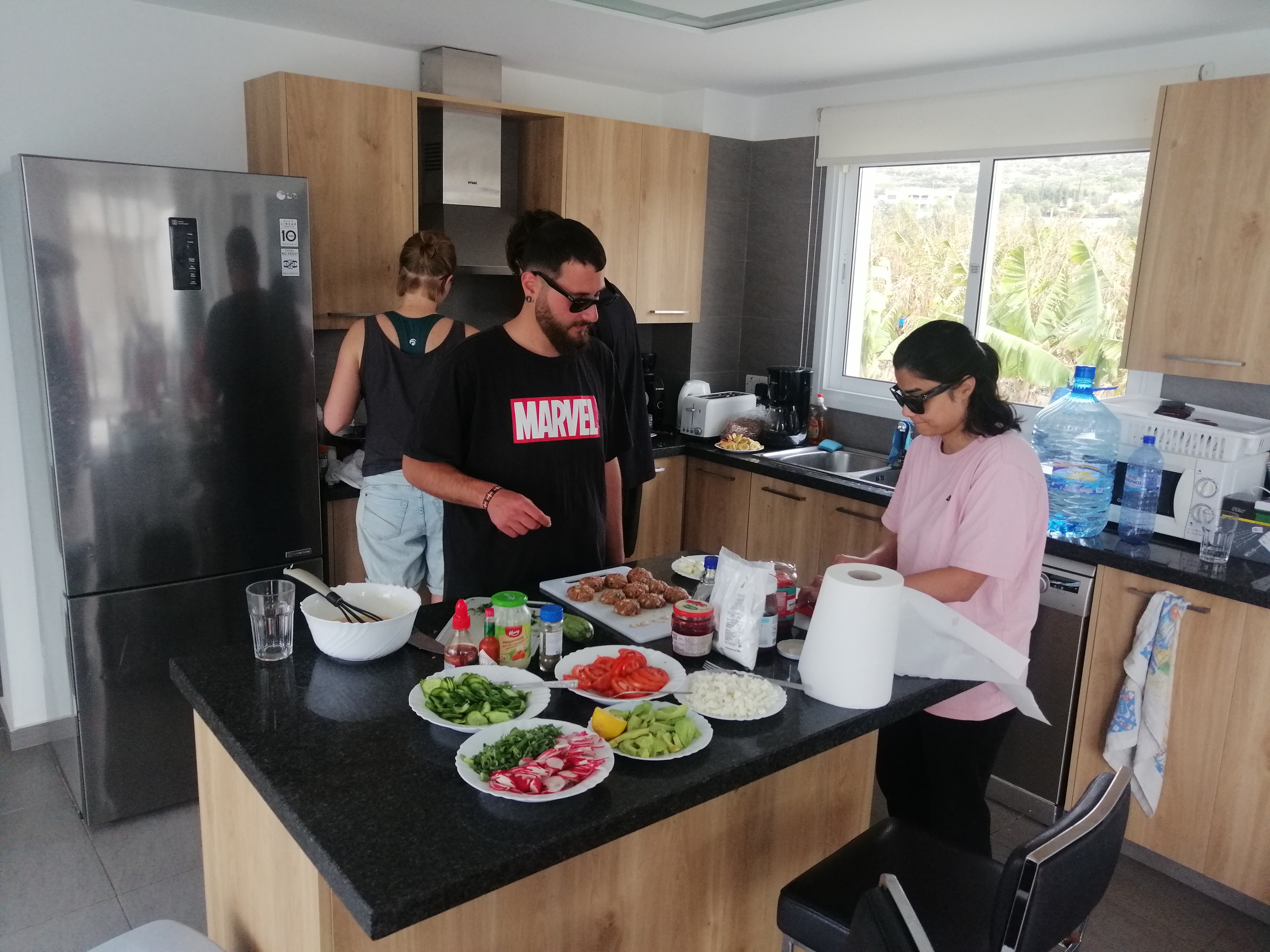 Cooking together in villa kitchen